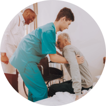 young male nurse assisting the old man